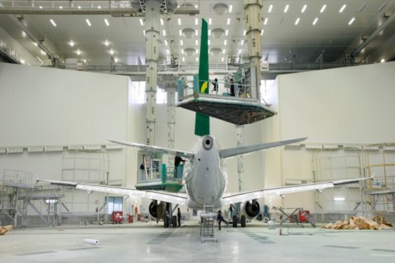 Hangar of the Satys paint shop in Sevilla with an airplain that is about to be painted.